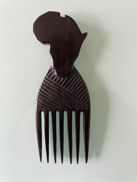 Handcarved comb of wood, Africa
